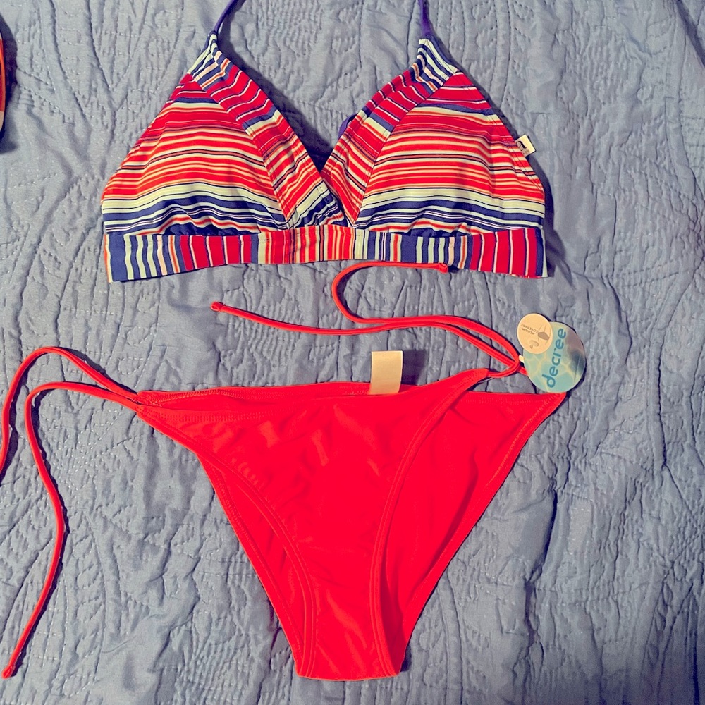 Bright peachy pink bikini bottoms multiple colored top. Made by decree,